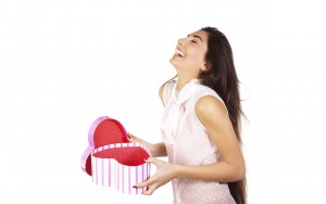 Image of pretty happy woman opening gift box isolated on white background, brunette female enjoying of present, cute teen girl laughing, romantic holiday, Valentine day, love concept